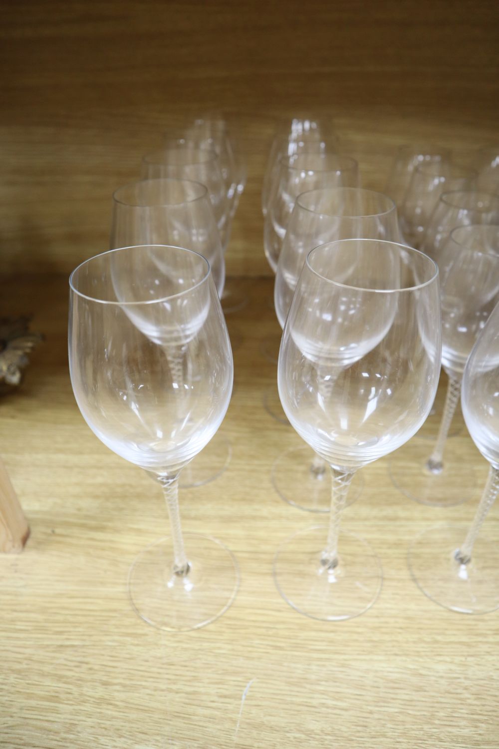 Twenty air twist stemmed wine glasses and eleven cut glass champagne flutes (31)